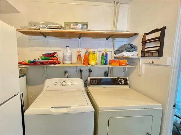 a utility room with dryer and washer