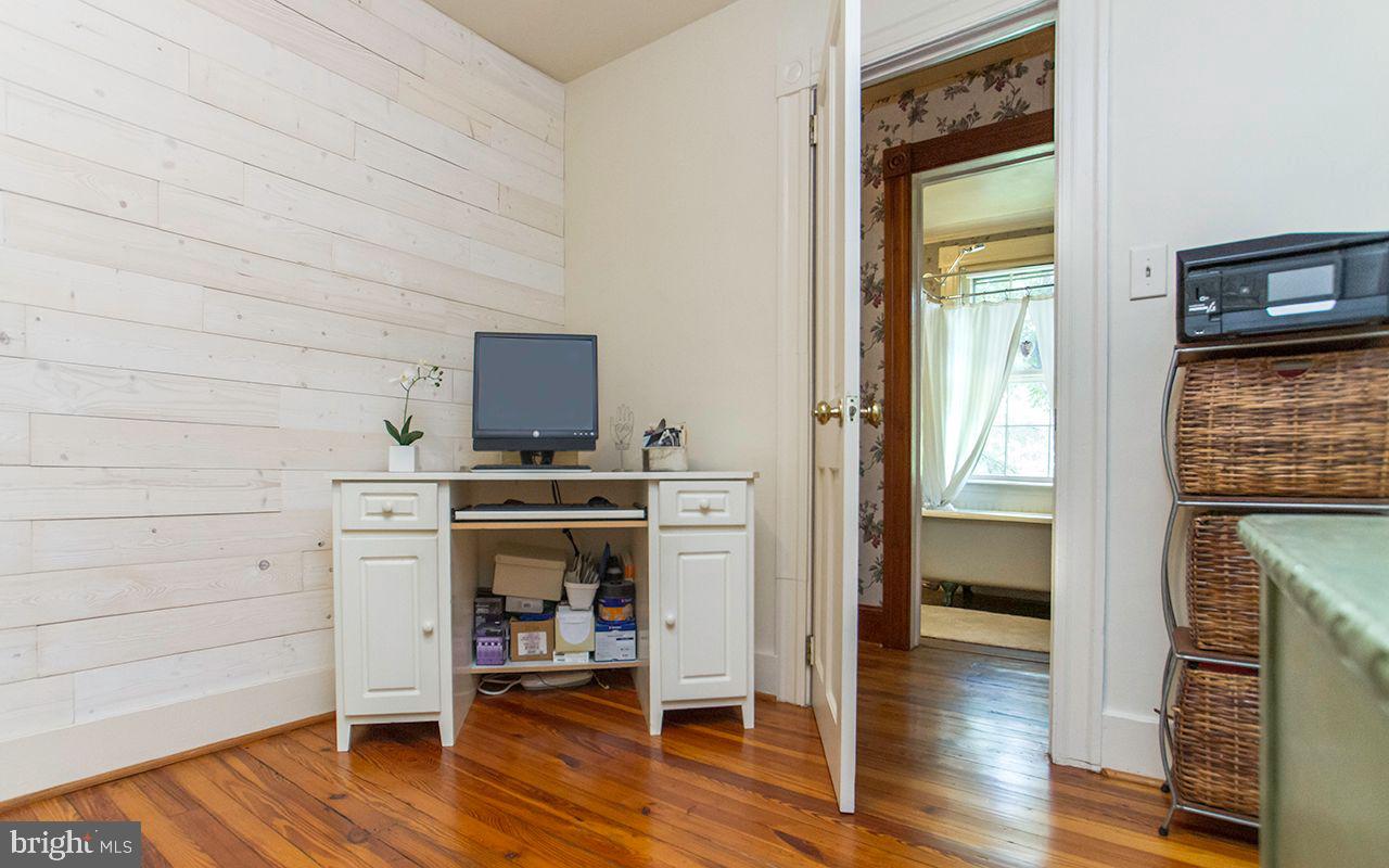 5137 Wetheredsville Road Baltimore, MD 21207 - Photo 40 of 89 a view of kitchen and hallway with wooden floor