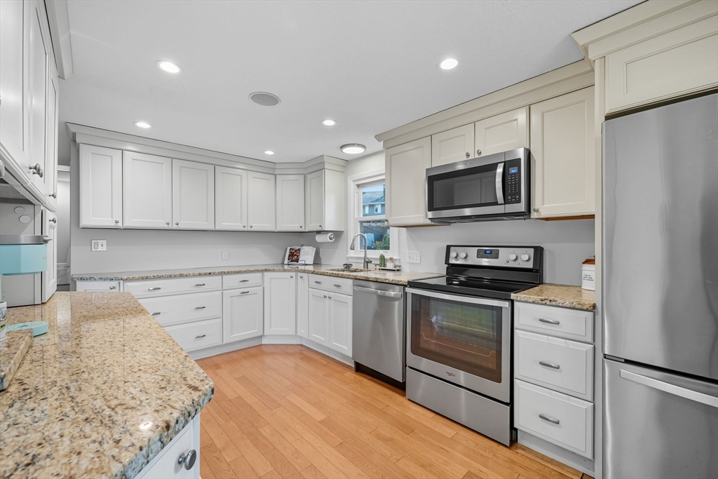 3 Nantucket Avenue Swampscott, MA 01907 - Photo 12 of 41 a kitchen with stainless steel appliances granite countertop a stove a sink and a microwave