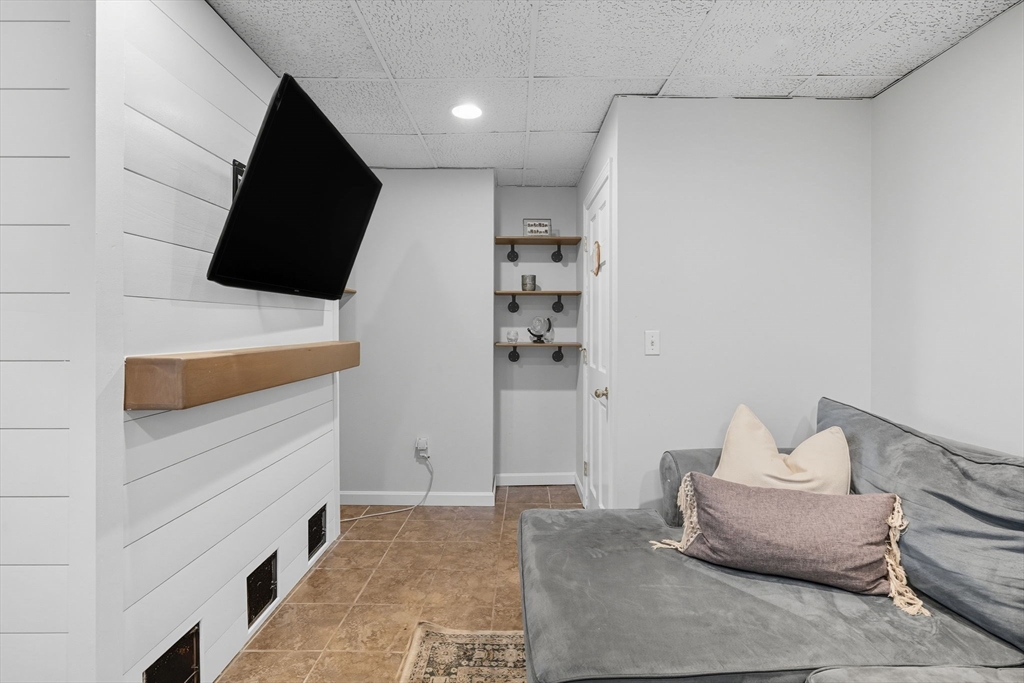 3 Nantucket Avenue Swampscott, MA 01907 - Photo 27 of 41 a living room with furniture and a flat screen tv