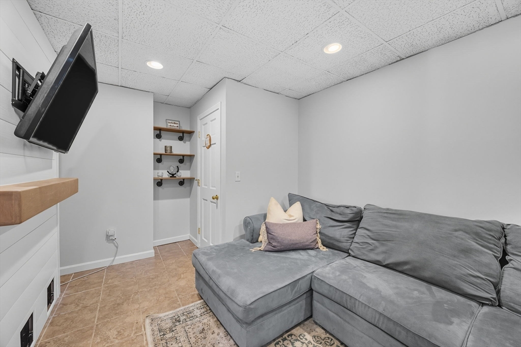 3 Nantucket Avenue Swampscott, MA 01907 - Photo 28 of 41 a living room with furniture and a flat screen tv