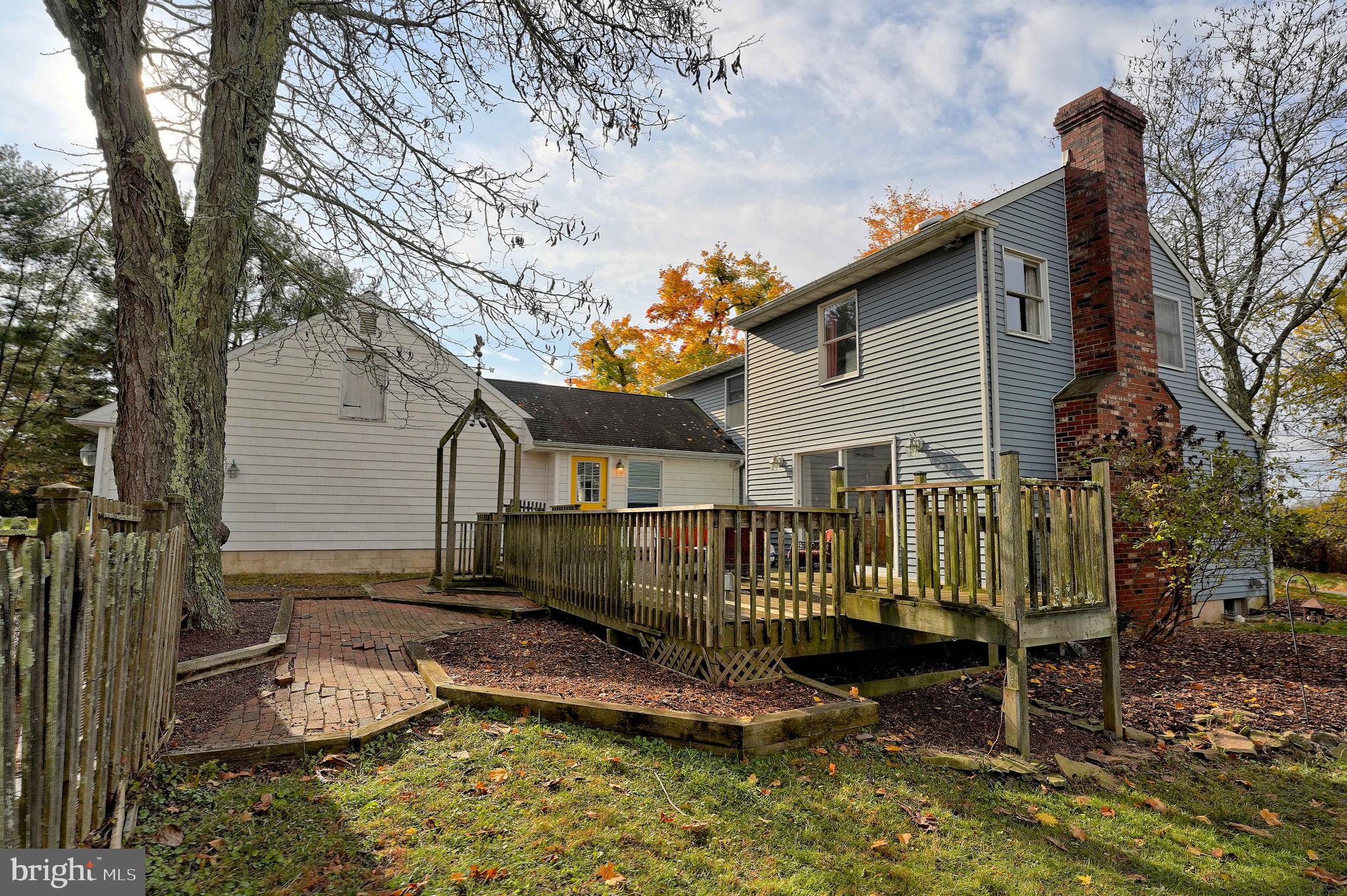 558 West Scotch Road Pennington, NJ 08534 - Photo 50 of 60 a view of a house with a wooden fence