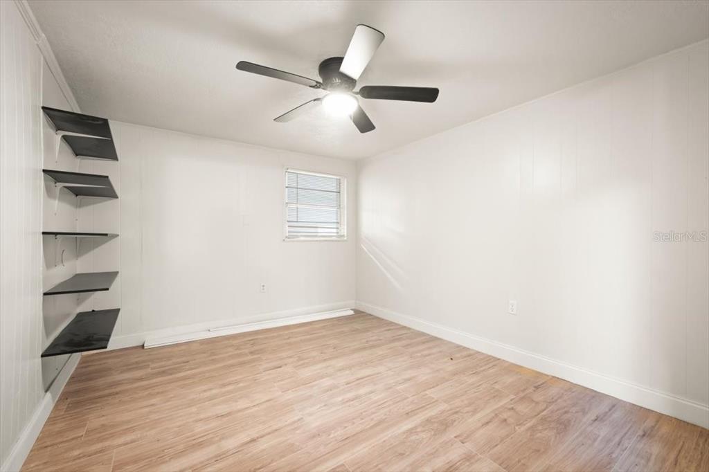 7903 New Kings Road Jacksonville, FL 32219 - Photo 15 of 28 wooden floor in an empty room with a window