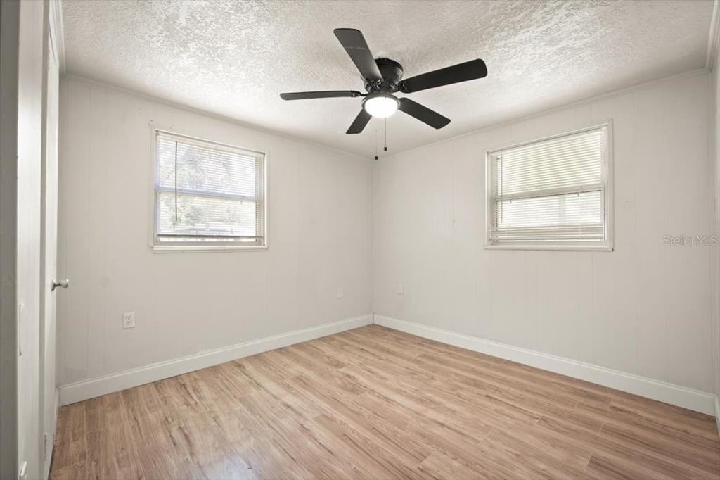 7903 New Kings Road Jacksonville, FL 32219 - Photo 20 of 28 wooden floor in an empty room with a window