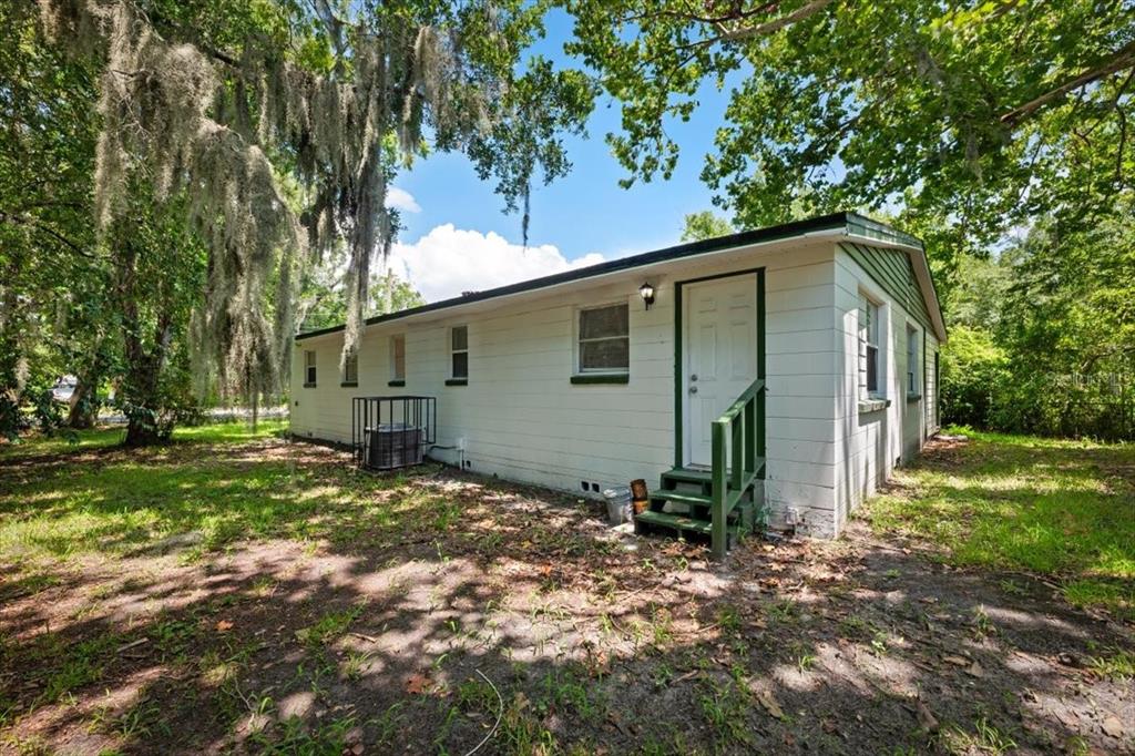 7903 New Kings Road Jacksonville, FL 32219 - Photo 26 of 28 a view of a barn house in the forest