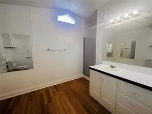 a view of a bathroom from a hallway