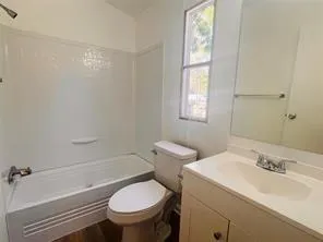 a view of storage and utility room with closet