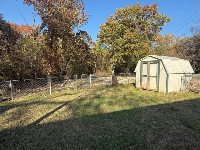 a view of back yard of a house