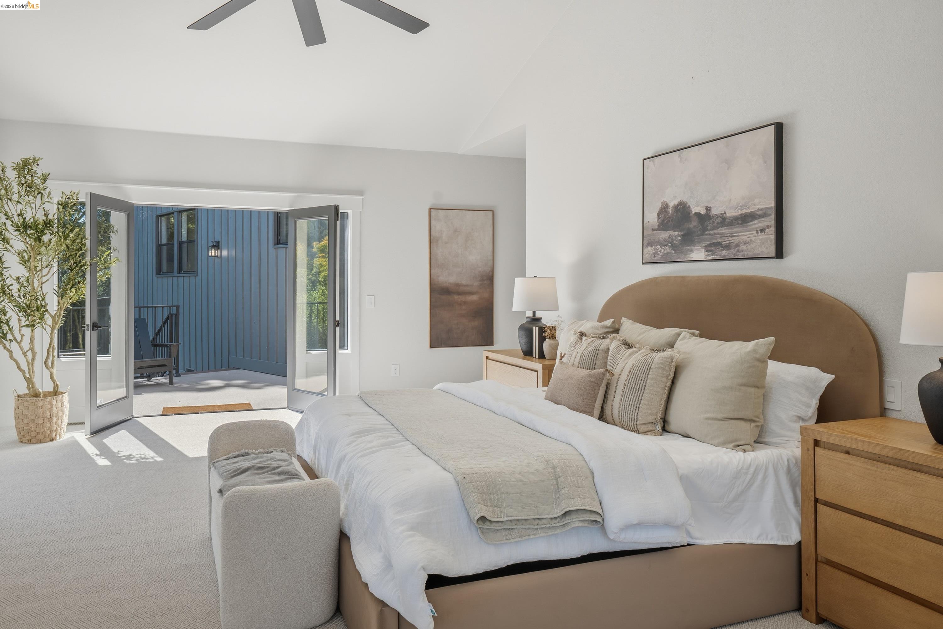 4120 Happy Valley Road Lafayette, CA 94549 - Photo 14 of 33 Light-filled interior featuring expansive glass French doors opening to an exterior patio with blue vertical siding