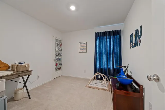 a room with furniture and air conditioner vent