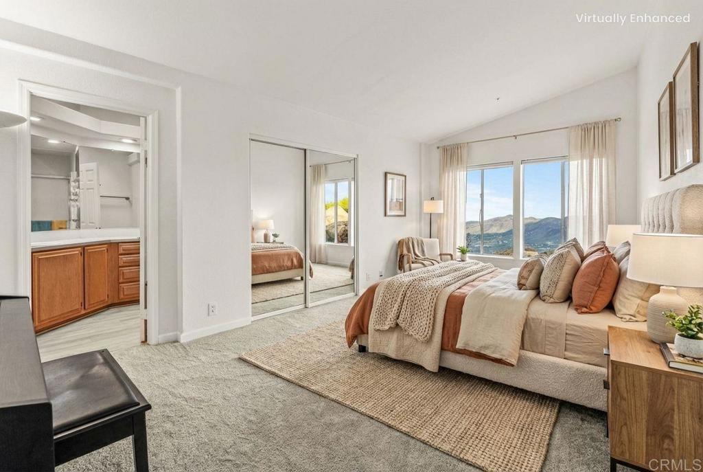 15351 Isla Vista Road Jamul, CA 91935 - Photo 18 of 40 a bedroom with a bed and a view of kitchen