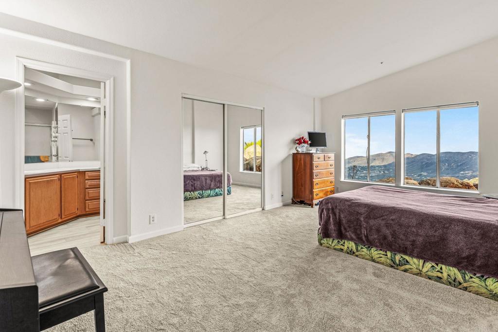 15351 Isla Vista Road Jamul, CA 91935 - Photo 19 of 40 a bed room with a bed and a window