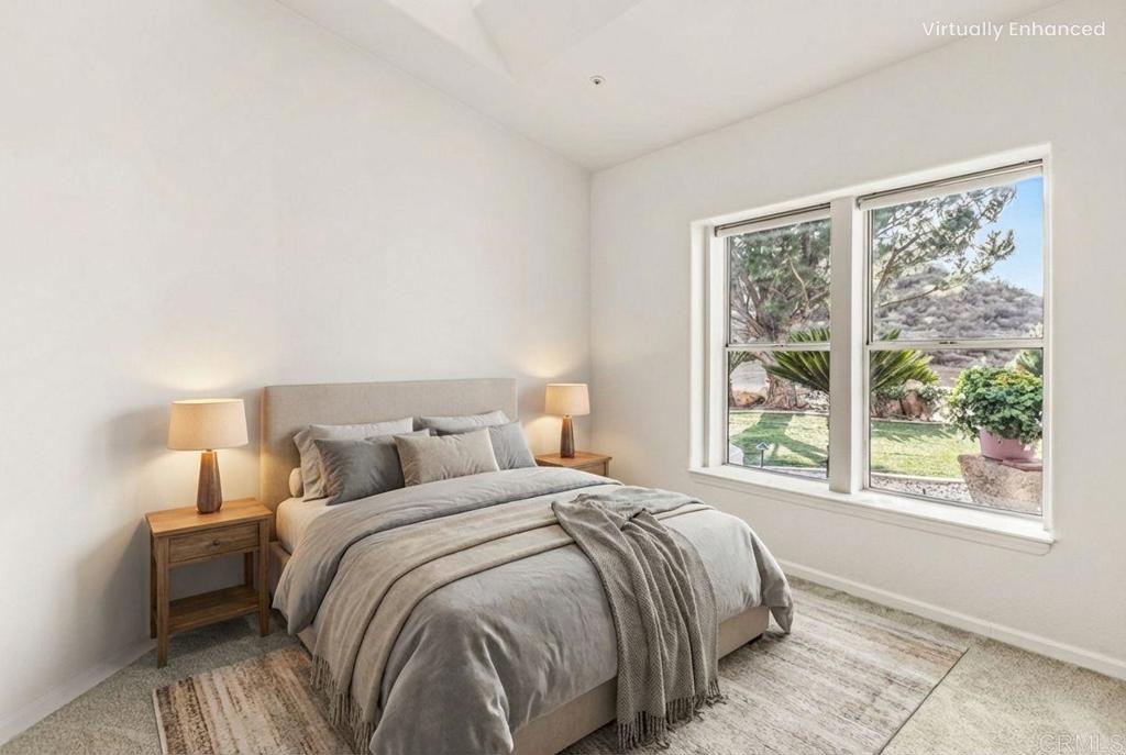 15351 Isla Vista Road Jamul, CA 91935 - Photo 20 of 40 a bedroom with a bed and a large window