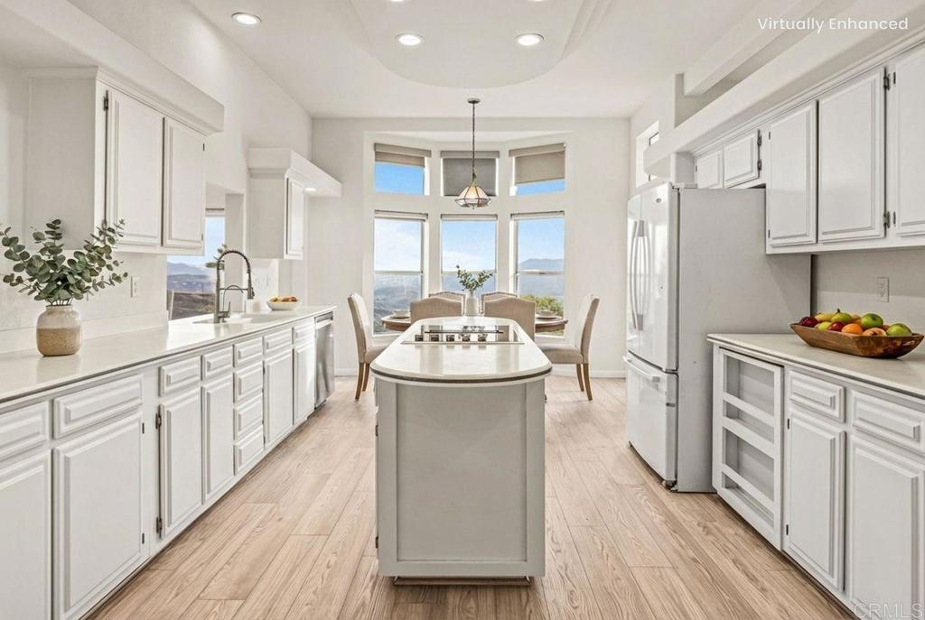 15351 Isla Vista Road Jamul, CA 91935 - Photo 6 of 40 a bathroom with a sink and a refrigerator