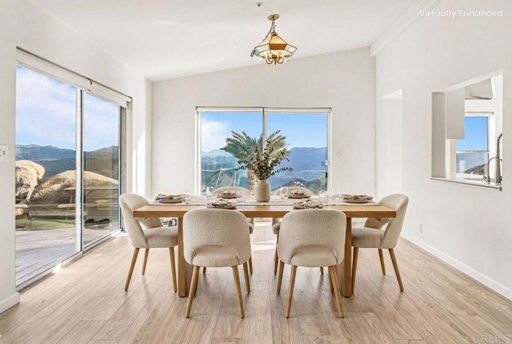 15351 Isla Vista Road Jamul, CA 91935 - Photo 8 of 40 a view of a dining room with furniture window and wooden floor