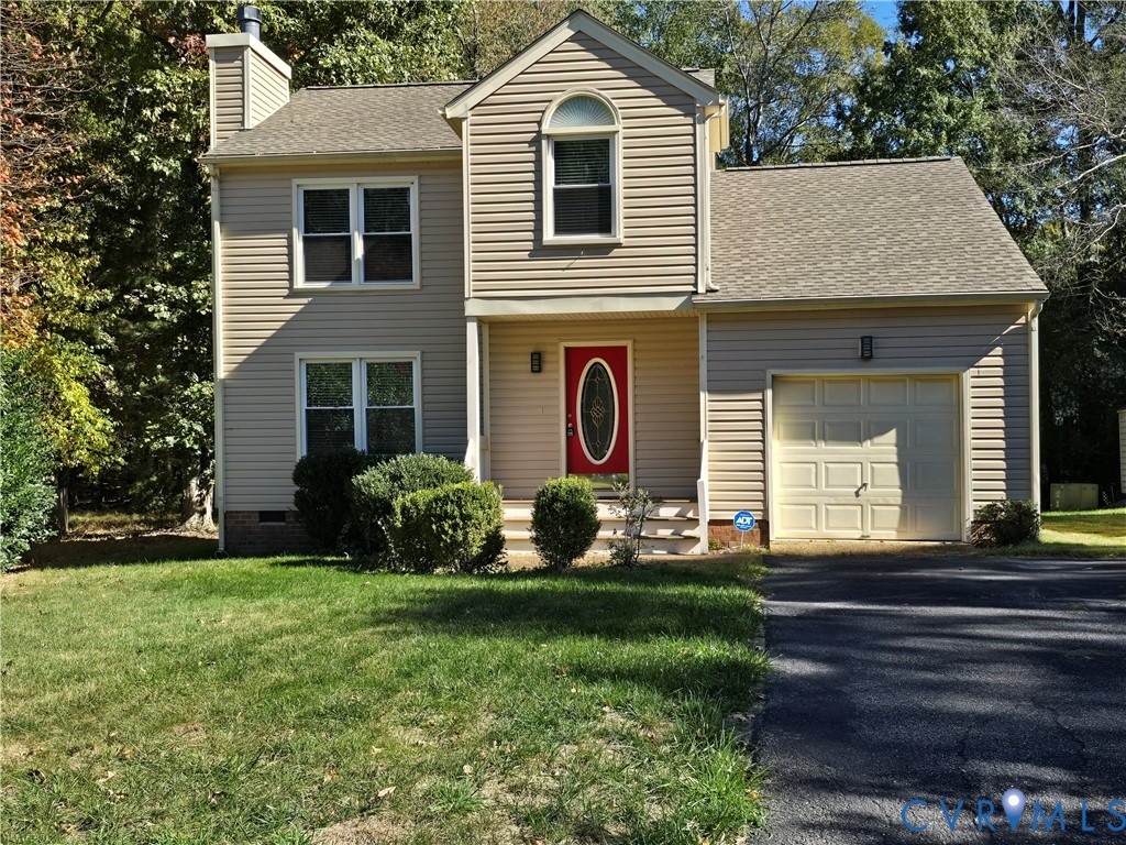 5716 Saddle Hill Drive Midlothian, VA 23112 - Photo 1 of 26 a front view of a house with garden