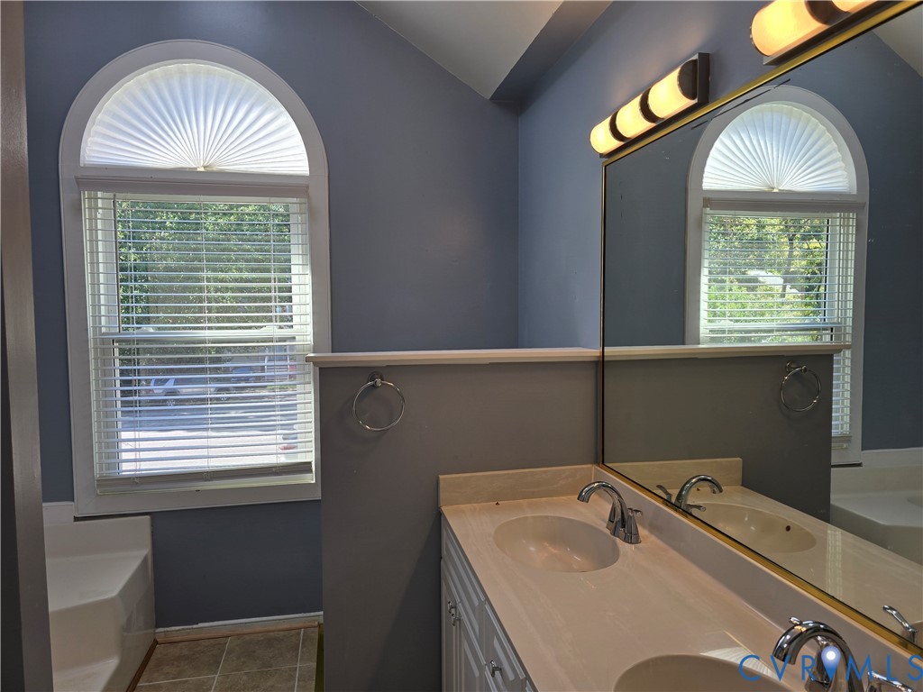 5716 Saddle Hill Drive Midlothian, VA 23112 - Photo 16 of 26 a bathroom with a sink and a mirror