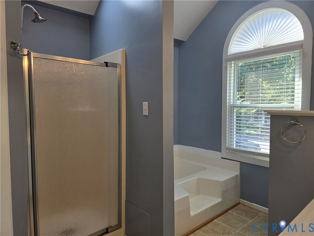 5716 Saddle Hill Drive Midlothian, VA 23112 - Photo 17 of 26 a bathroom with a bathtub and a shower