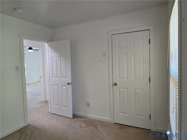 an empty room with closet area