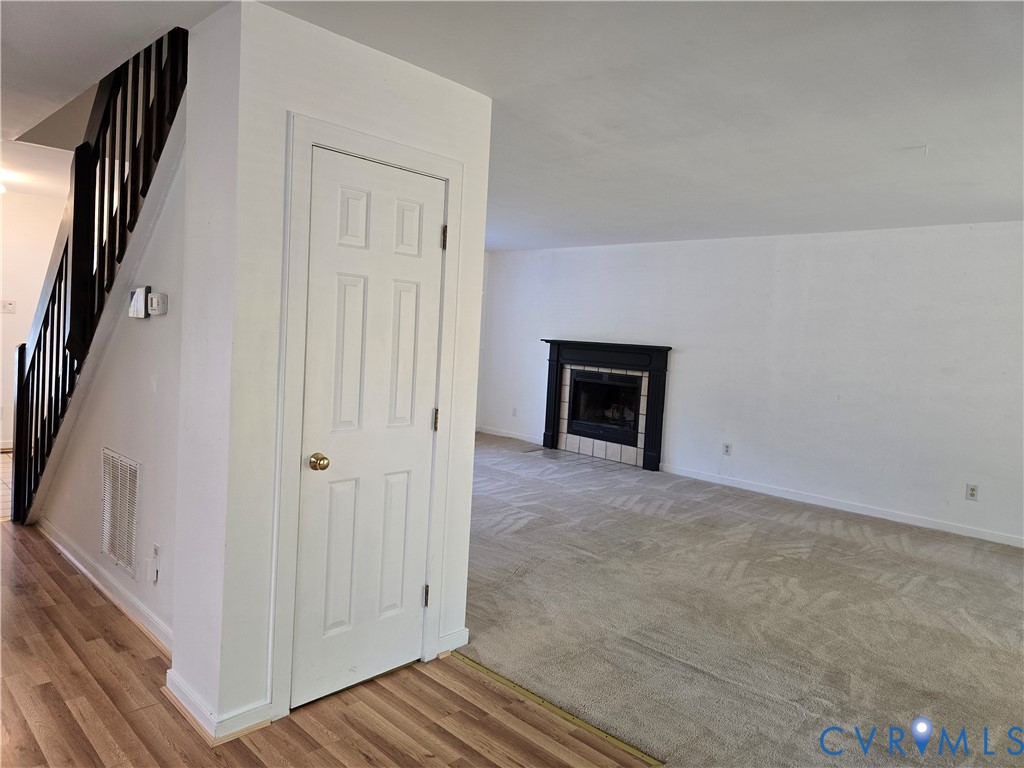 5716 Saddle Hill Drive Midlothian, VA 23112 - Photo 7 of 26 an empty room with windows
