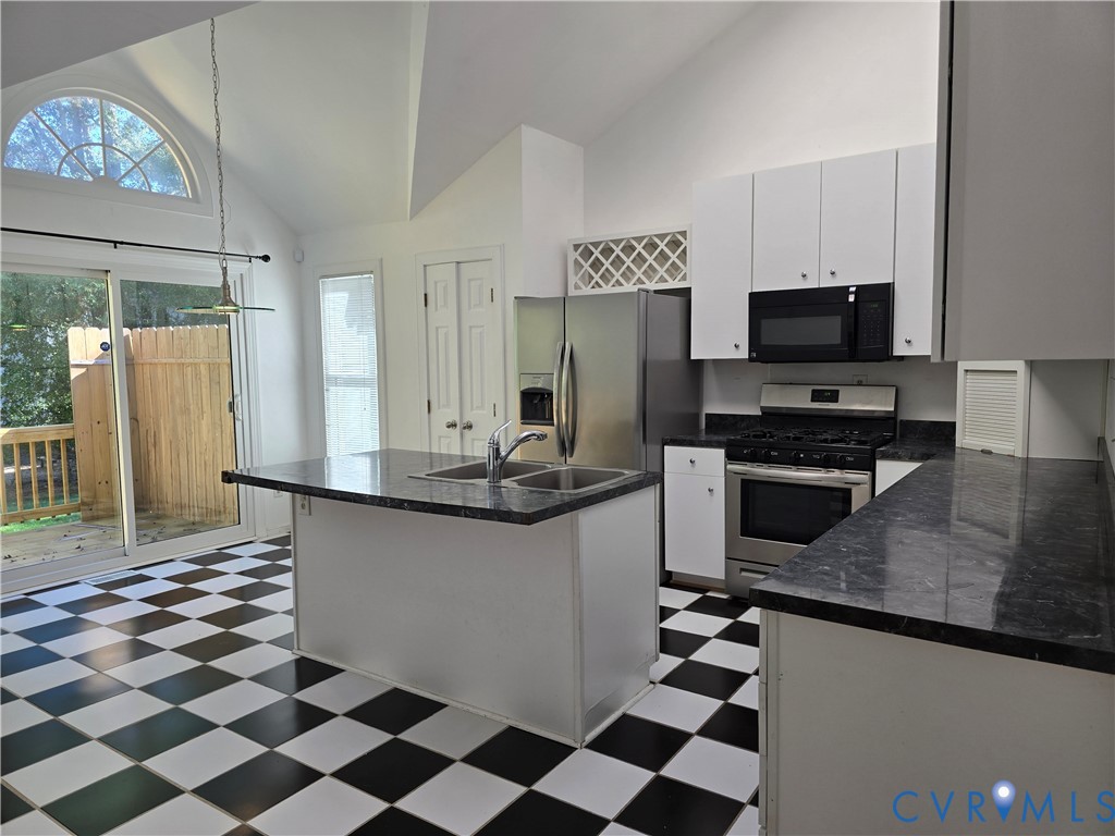 5716 Saddle Hill Drive Midlothian, VA 23112 - Photo 10 of 26 a kitchen with granite countertop a sink and a stove top oven
