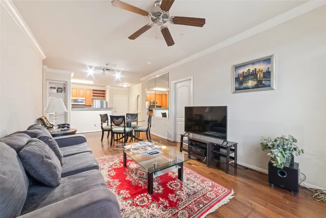 an outdoor space with lots of furniture and wooden floor