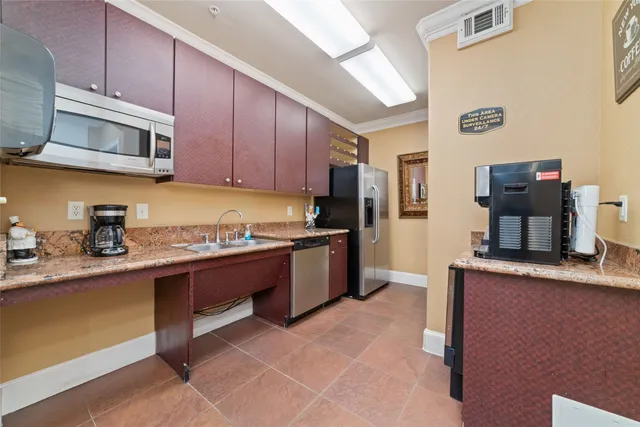 a view of a livingroom with furniture wooden floor and a ceiling fan