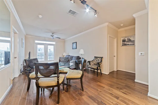 a kitchen with counter top space and wooden floor