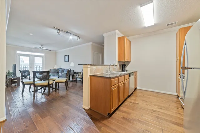 a living room with furniture and white walls