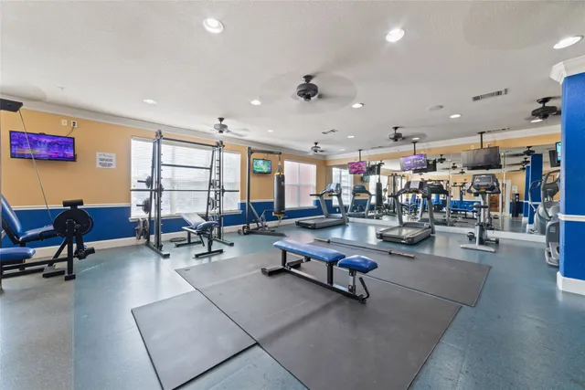 a kitchen with granite countertop a sink cabinets and stainless steel appliances