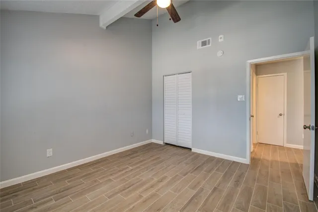 wooden floor in an empty room with a workspace