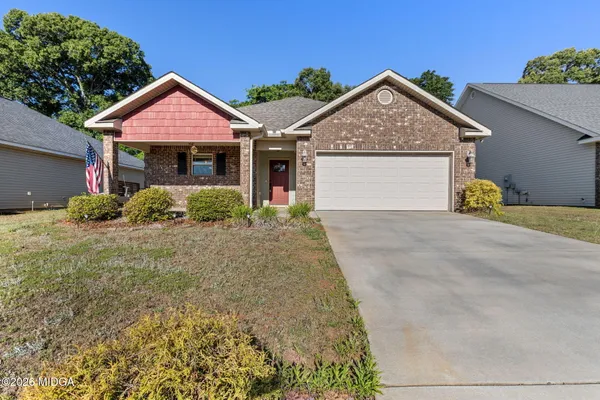 front view of a house with a yard