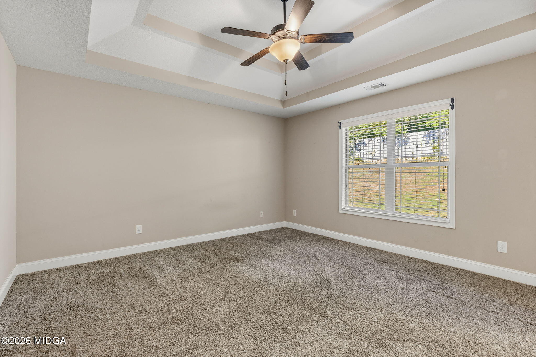 109 Hawks Rdg Trace Byron, GA 31008 - Photo 12 of 26 an empty room with a window and a fan