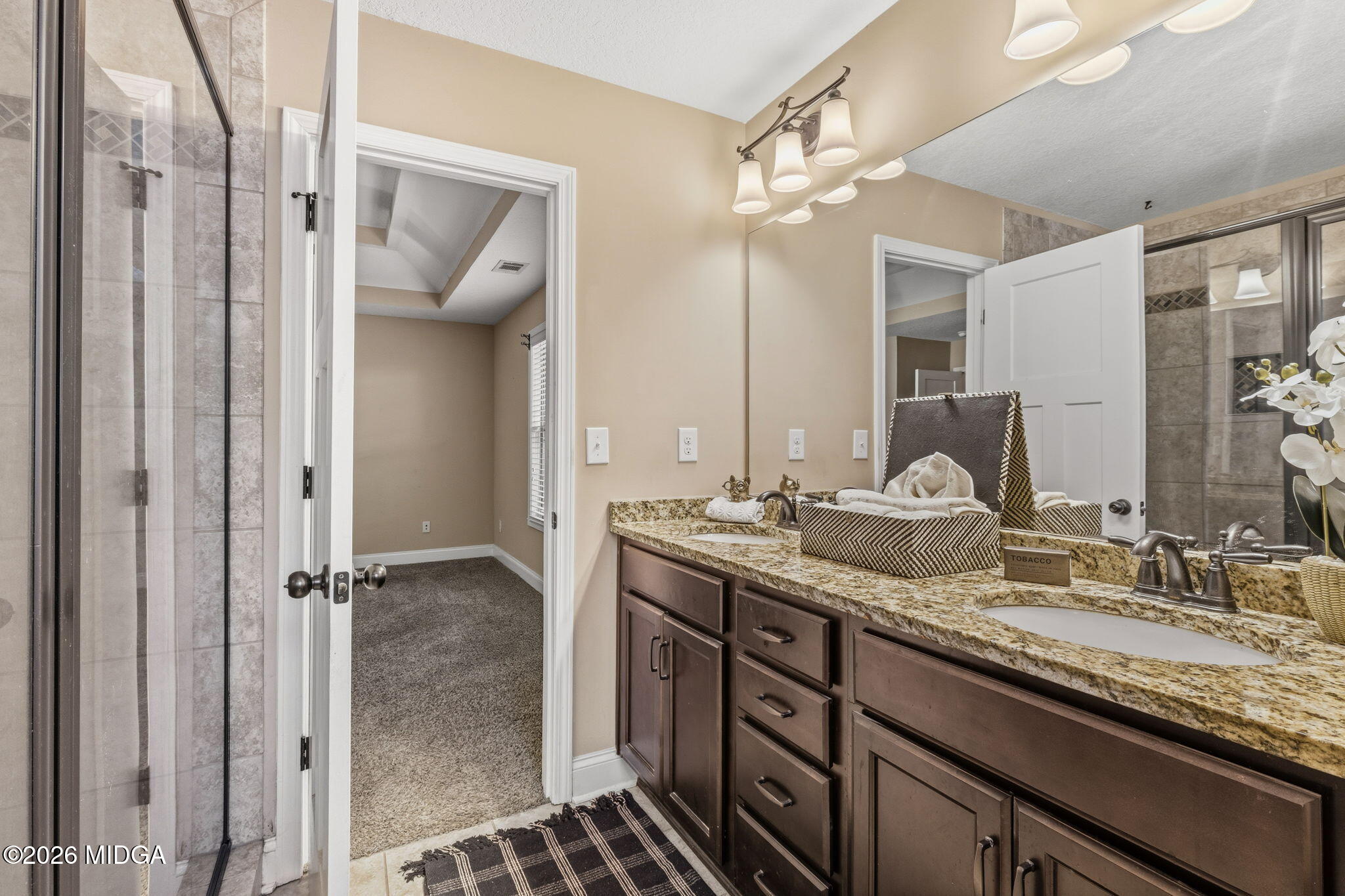 109 Hawks Rdg Trace Byron, GA 31008 - Photo 14 of 26 a bathroom with double vanity and a mirror