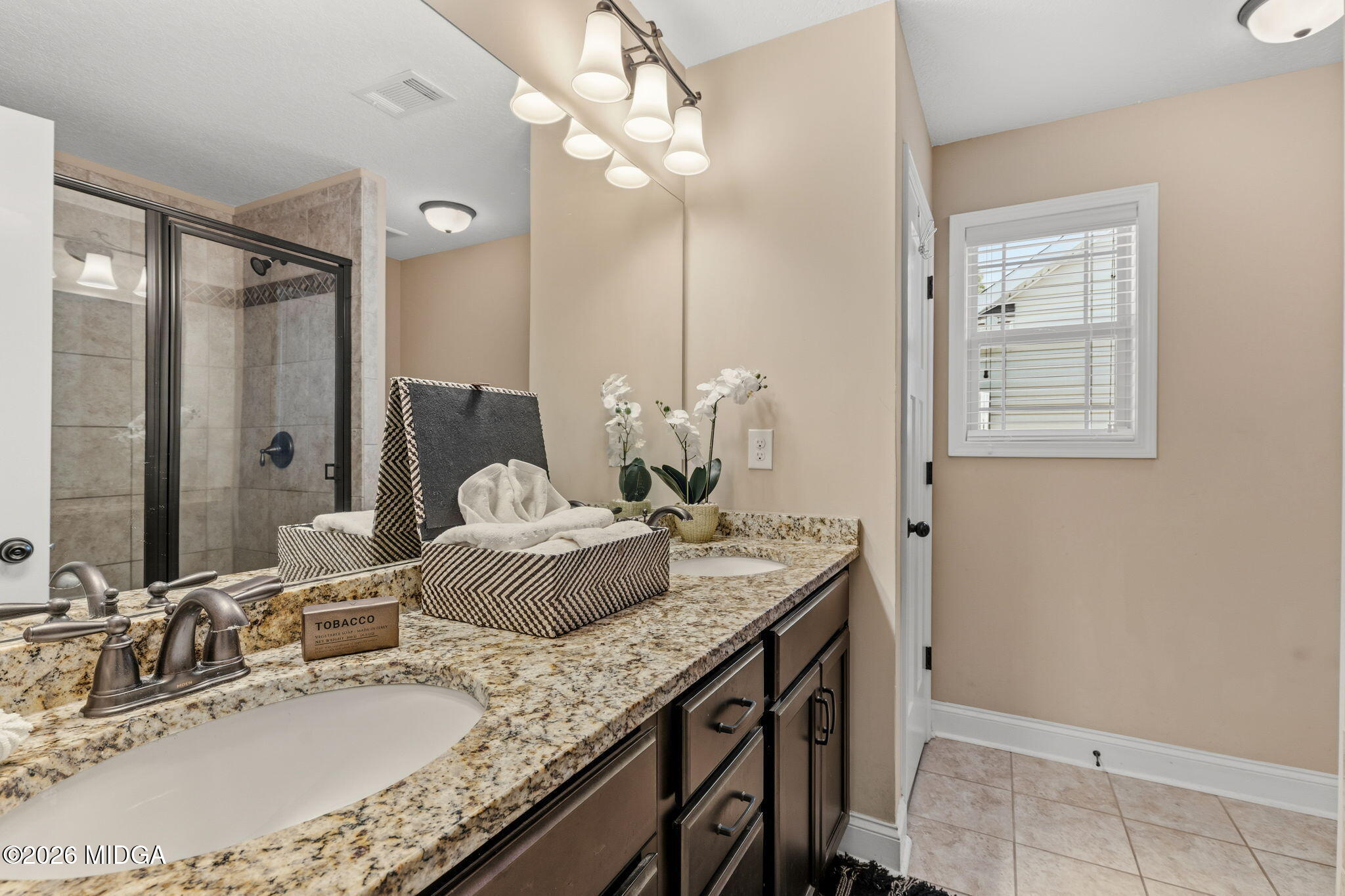 109 Hawks Rdg Trace Byron, GA 31008 - Photo 15 of 26 a bathroom with a granite countertop sink a mirror and a