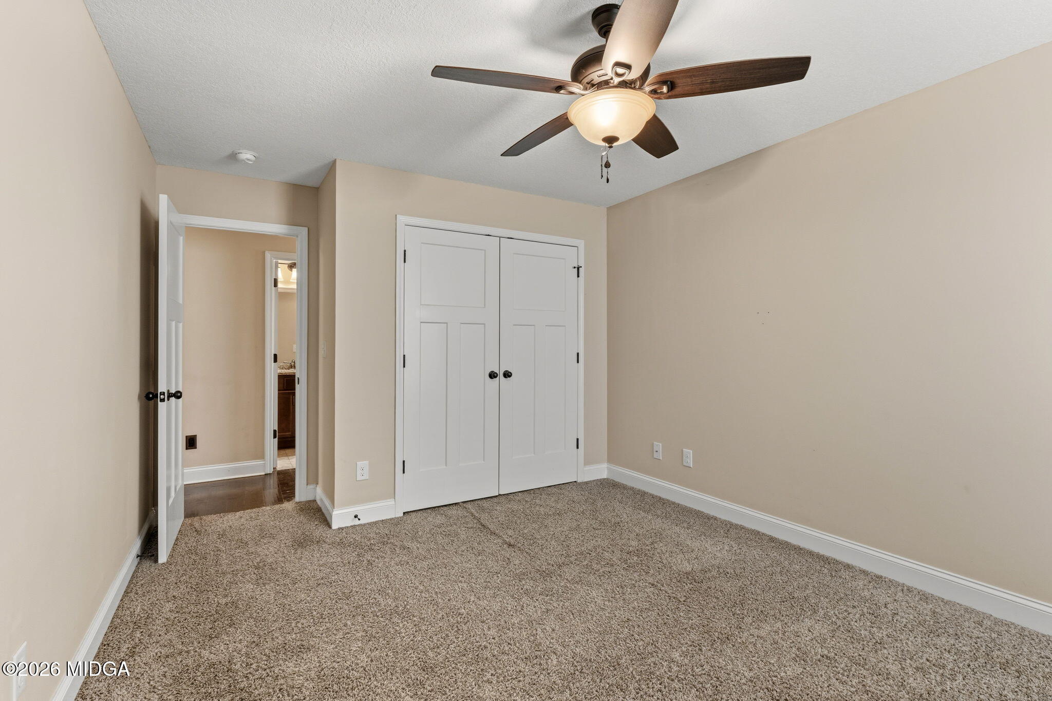 109 Hawks Rdg Trace Byron, GA 31008 - Photo 21 of 26 an empty room with a ceiling fan and a window