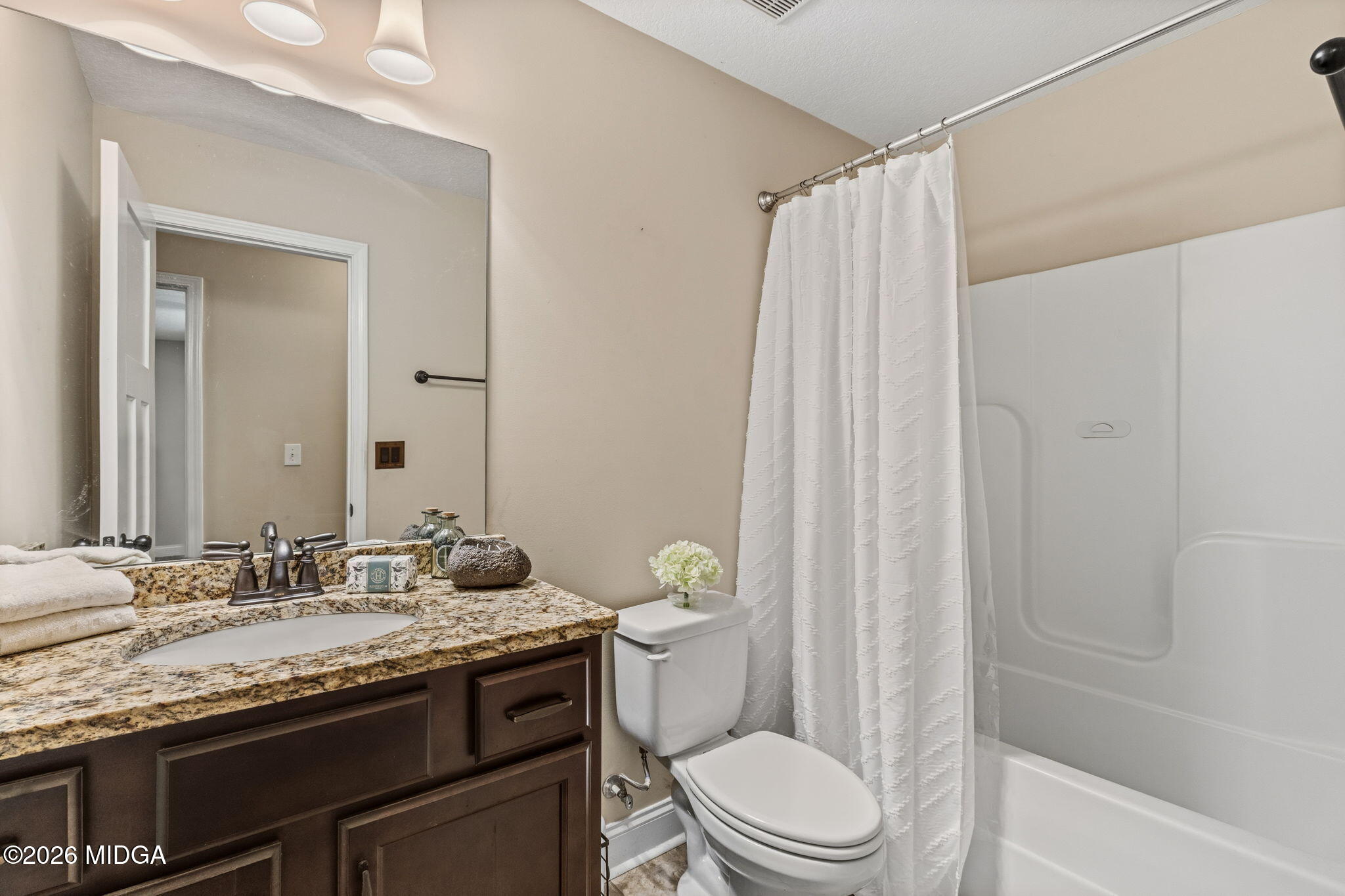 109 Hawks Rdg Trace Byron, GA 31008 - Photo 22 of 26 a bathroom with a granite countertop sink toilet and shower