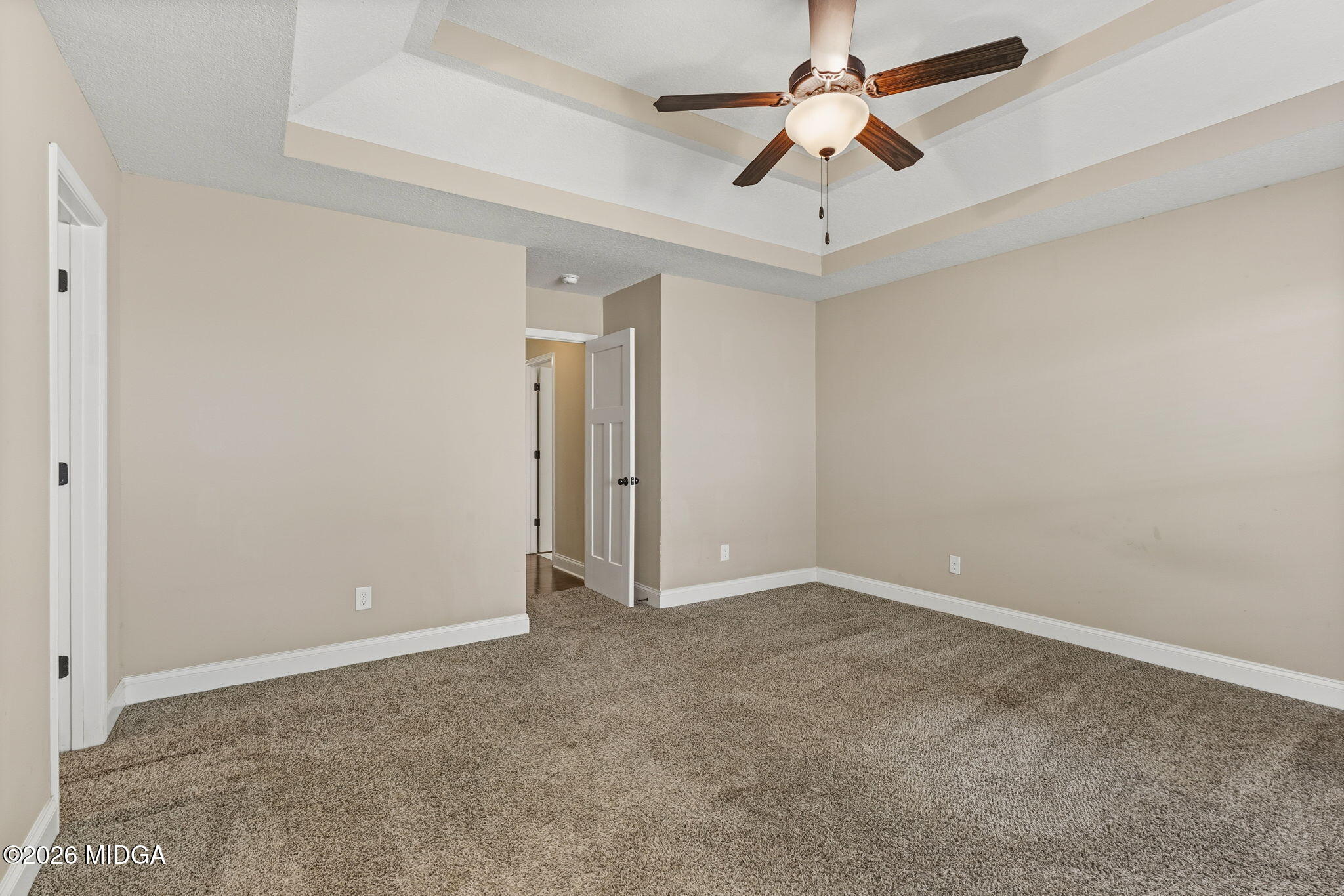 109 Hawks Rdg Trace Byron, GA 31008 - Photo 10 of 26 an empty room with a ceiling fan and a ceiling fan