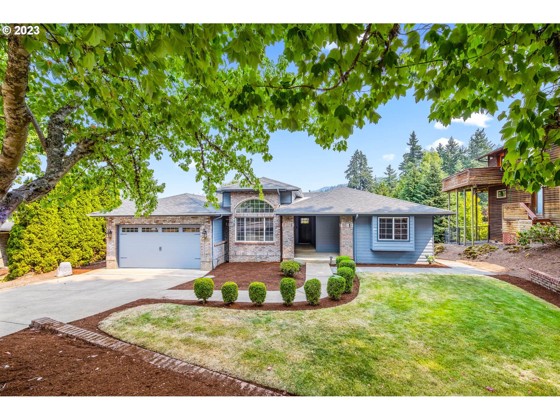 a front view of a house with garden