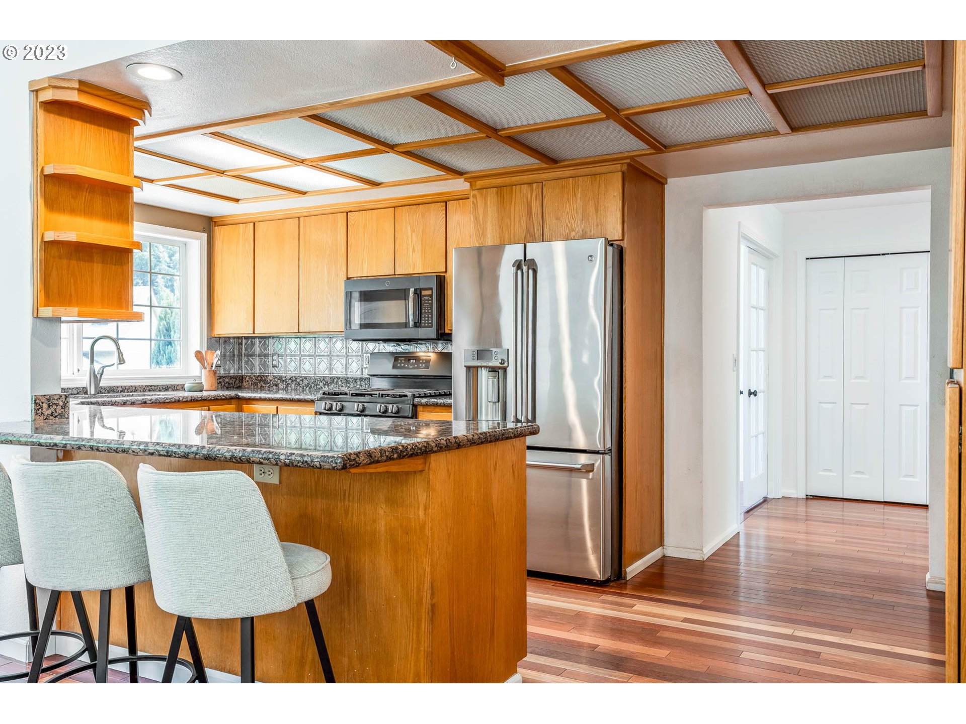 789 South 69th Street Springfield, OR 97478 - Photo 22 of 46 a kitchen with stainless steel appliances granite countertop a refrigerator and a stove top oven