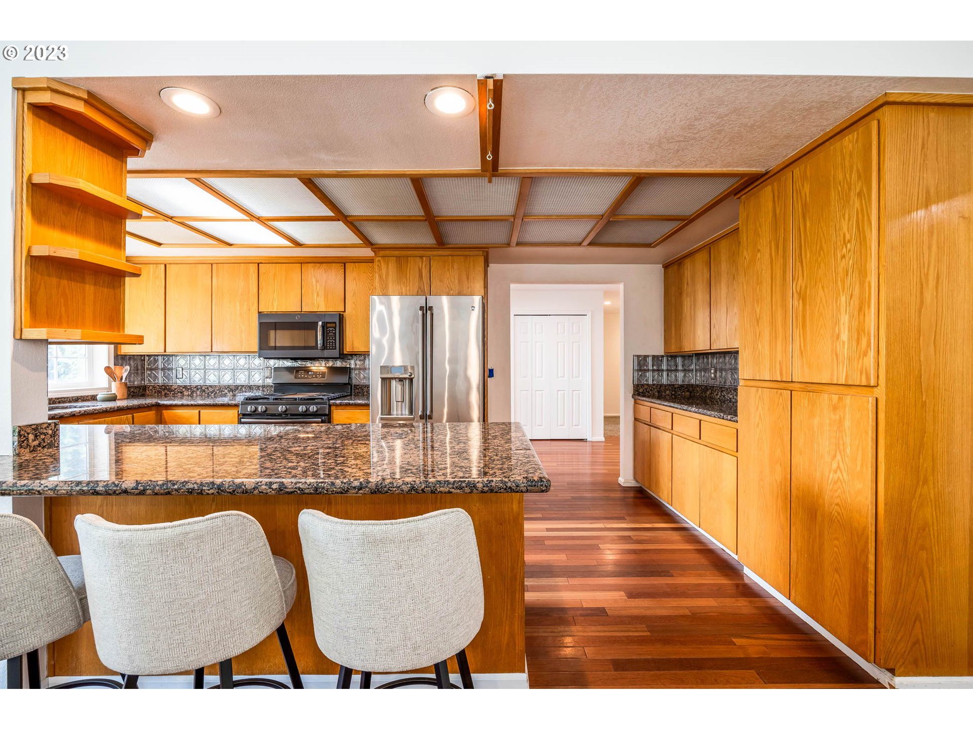 789 South 69th Street Springfield, OR 97478 - Photo 23 of 46 a kitchen with stainless steel appliances granite countertop a sink and cabinets