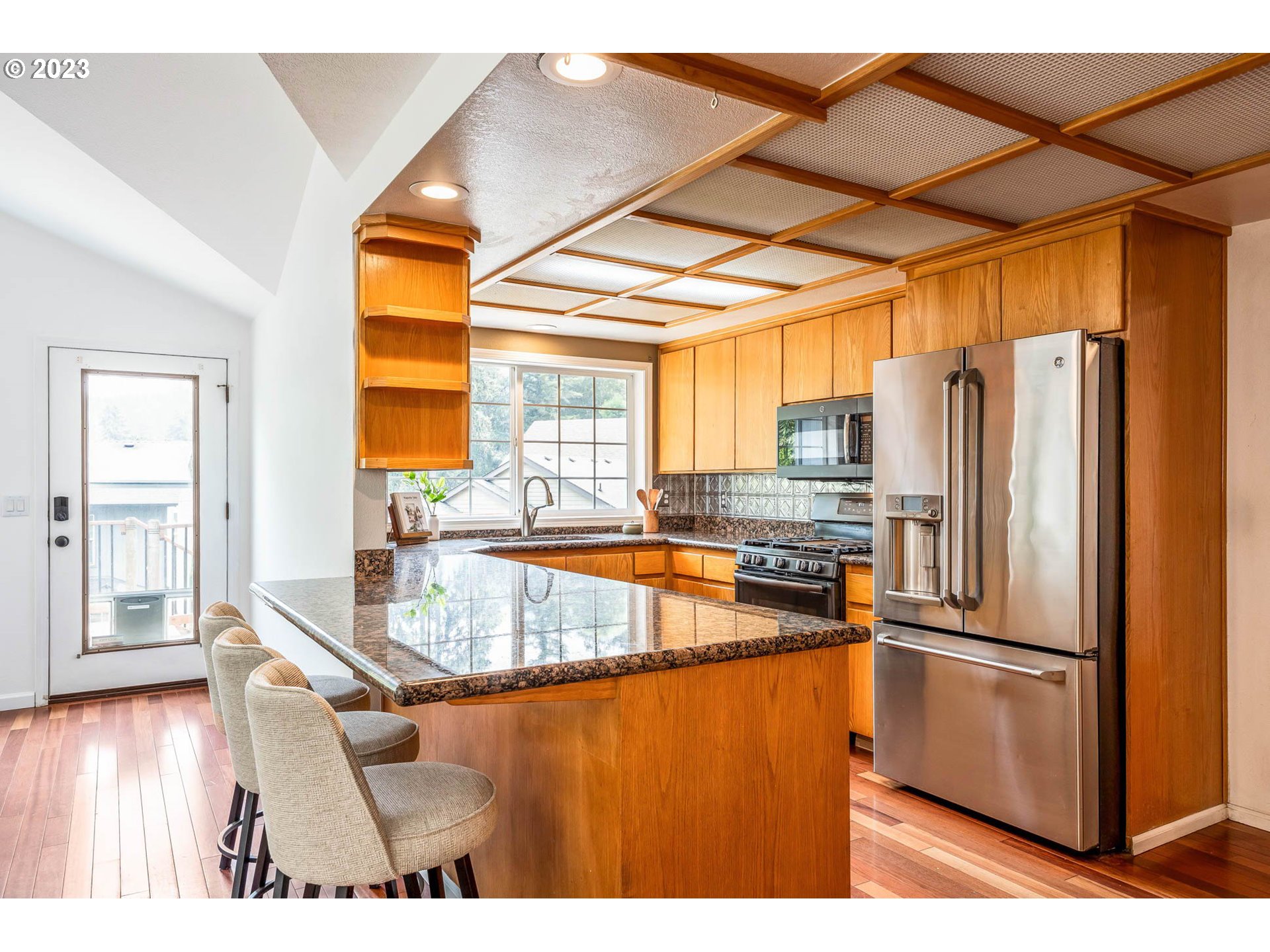 789 South 69th Street Springfield, OR 97478 - Photo 24 of 46 a kitchen with stainless steel appliances granite countertop a refrigerator and a stove top oven