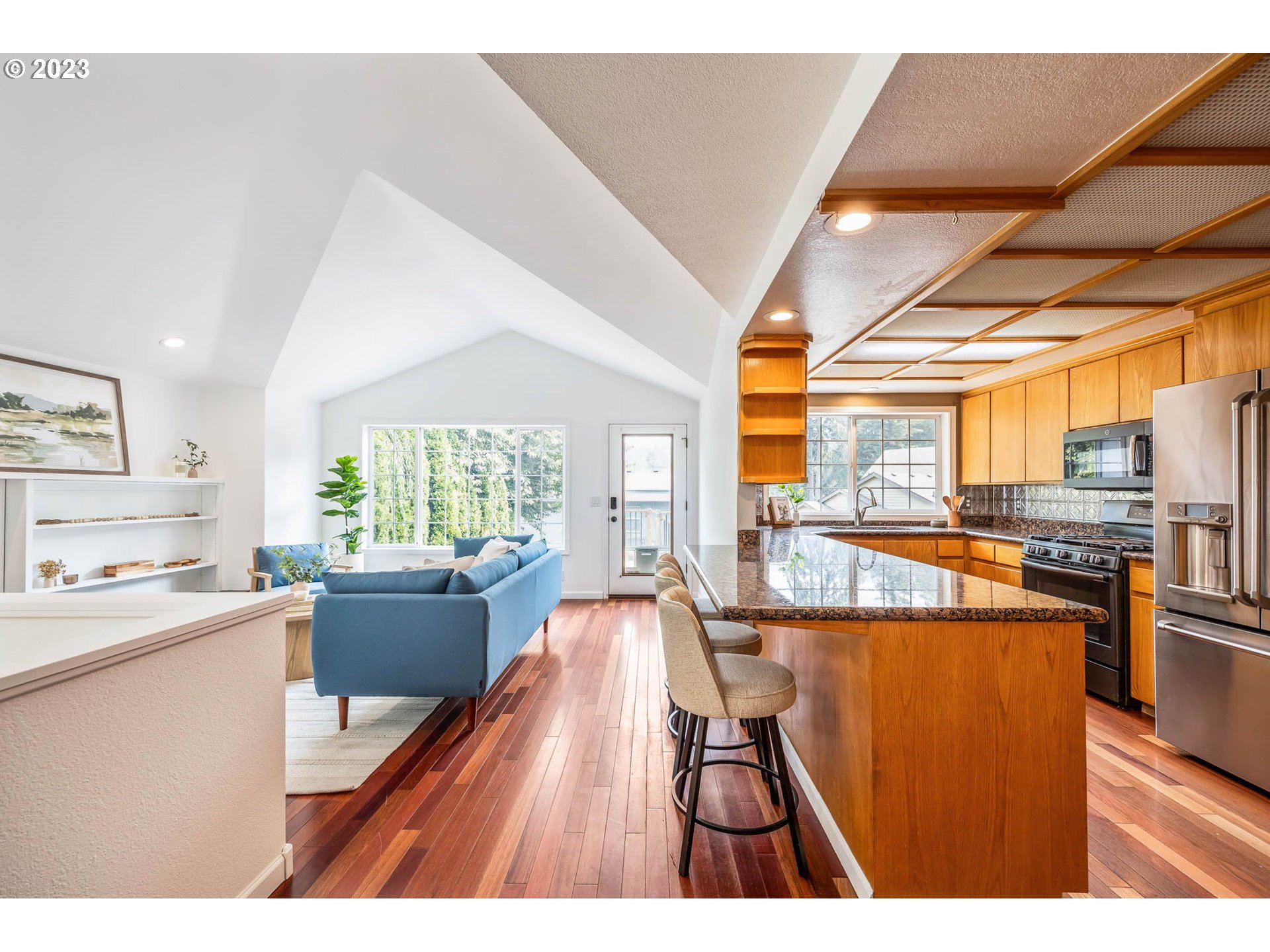 789 South 69th Street Springfield, OR 97478 - Photo 27 of 46 a open kitchen with stainless steel appliances granite countertop a stove and a refrigerator