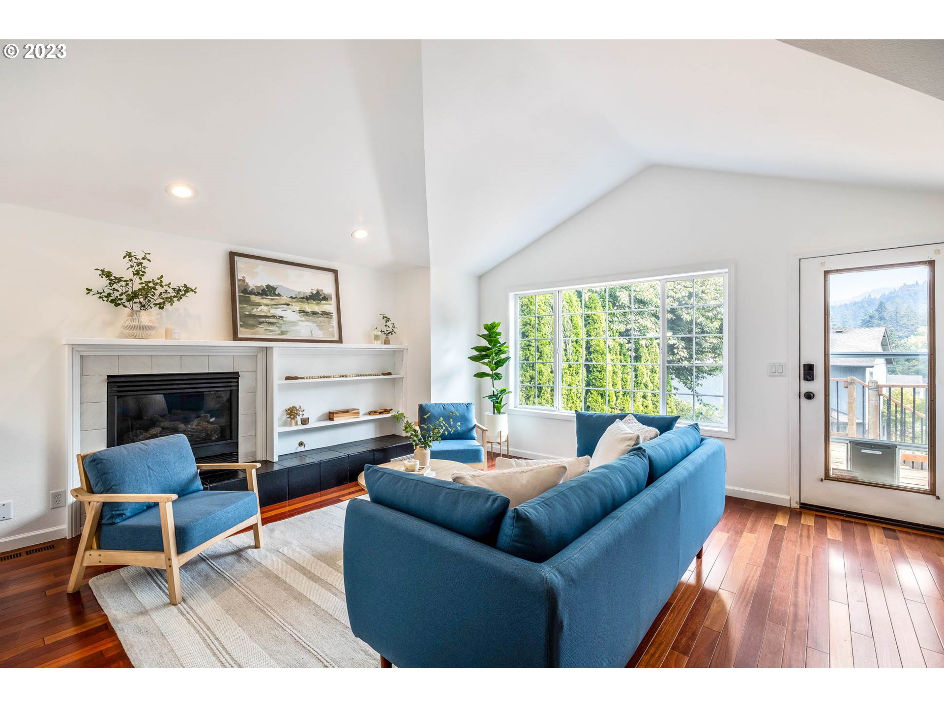 789 South 69th Street Springfield, OR 97478 - Photo 28 of 46 a living room with furniture and a fireplace