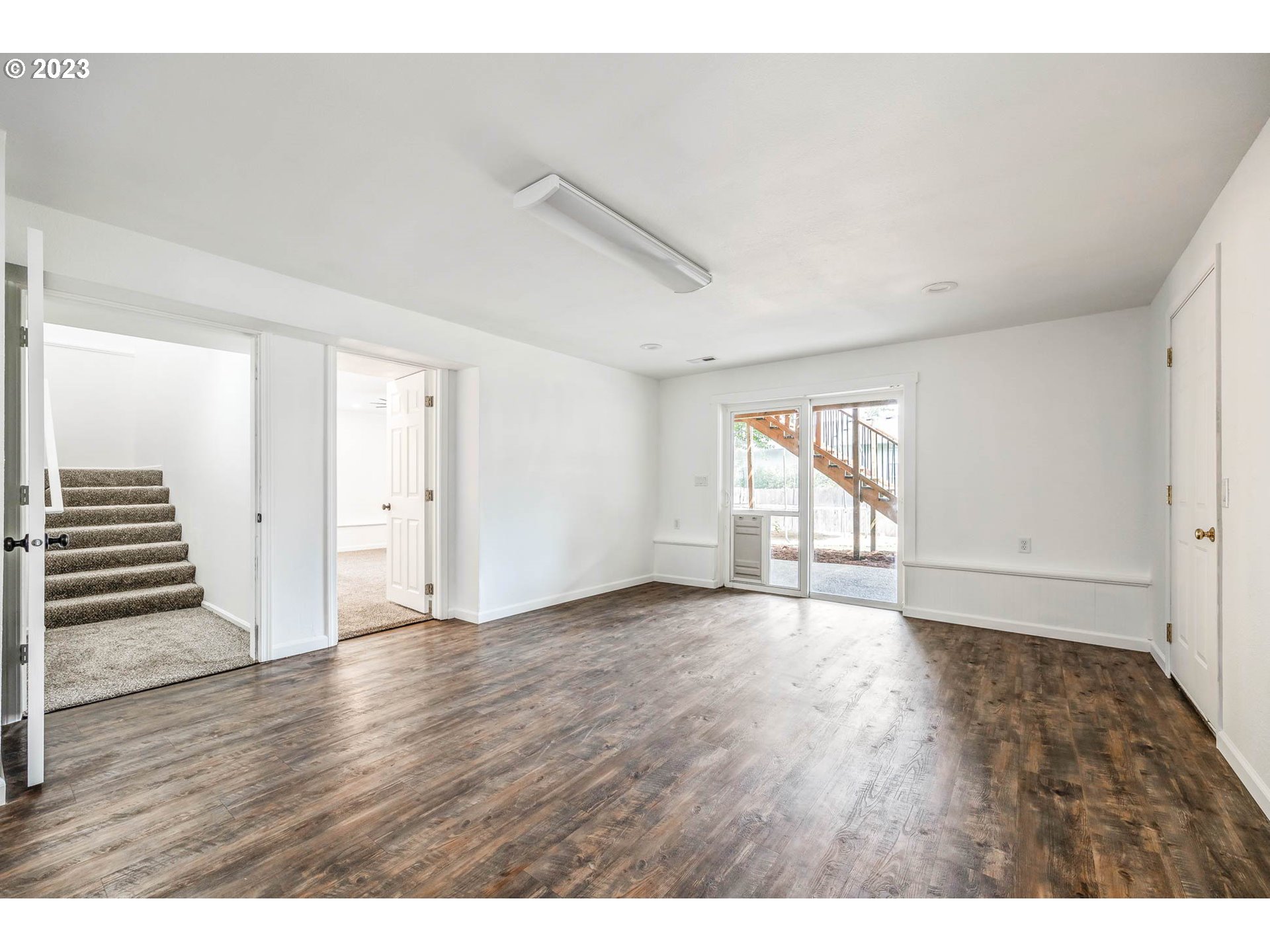 789 South 69th Street Springfield, OR 97478 - Photo 36 of 46 a view of an empty room with wooden floor and window