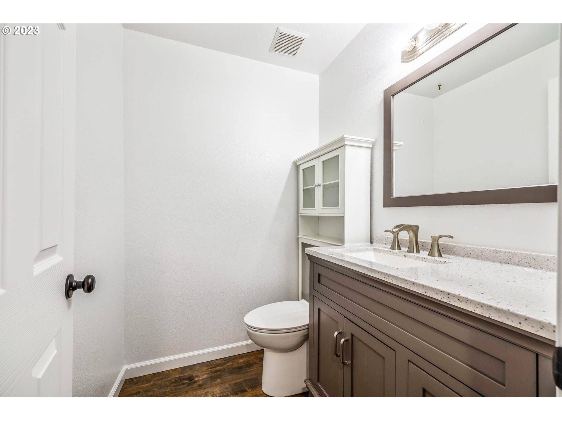789 South 69th Street Springfield, OR 97478 - Photo 38 of 46 a bathroom with a granite countertop sink a toilet and a mirror