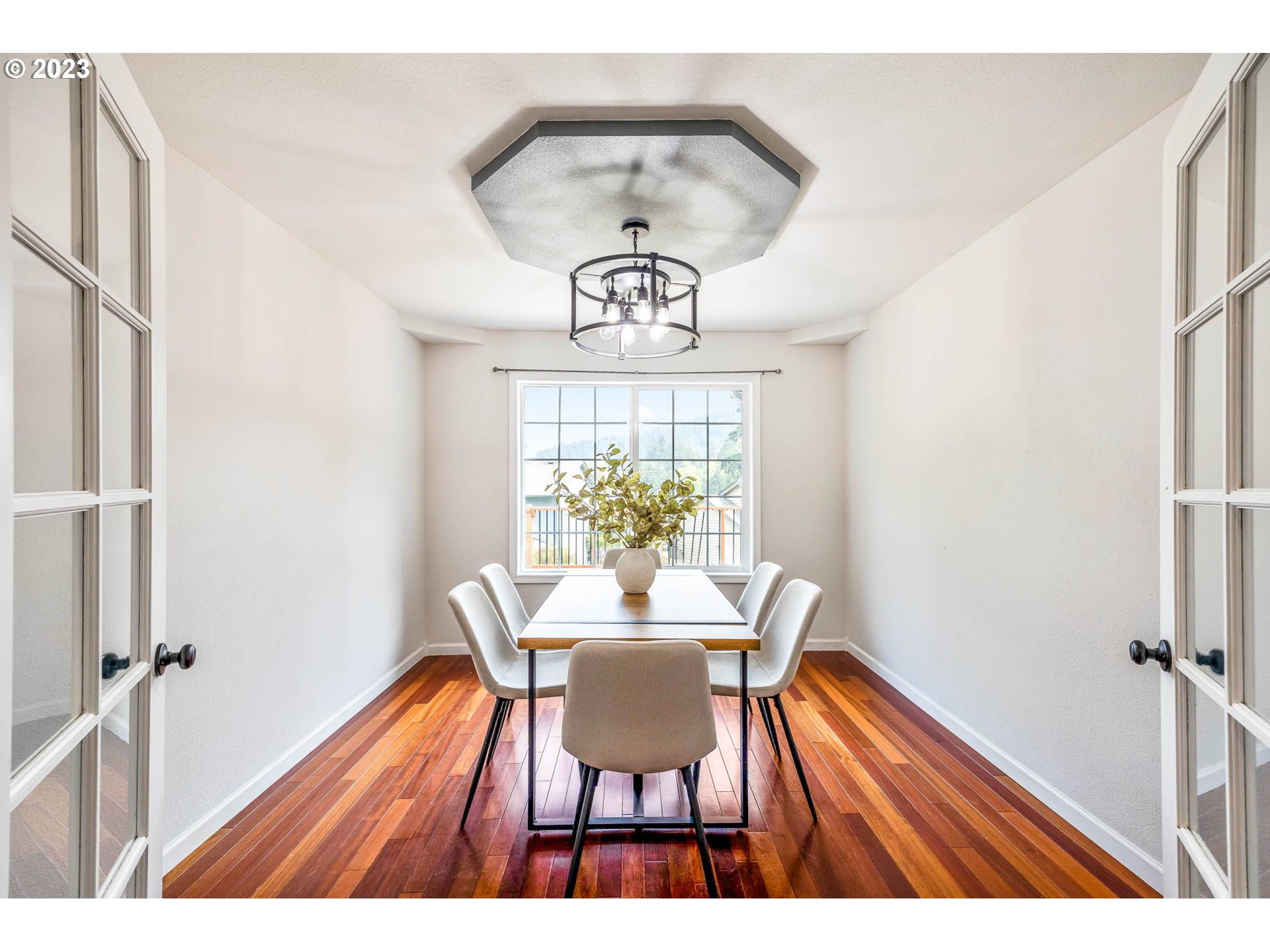 789 South 69th Street Springfield, OR 97478 - Photo 8 of 46 a view of a dining room with furniture window and wooden floor