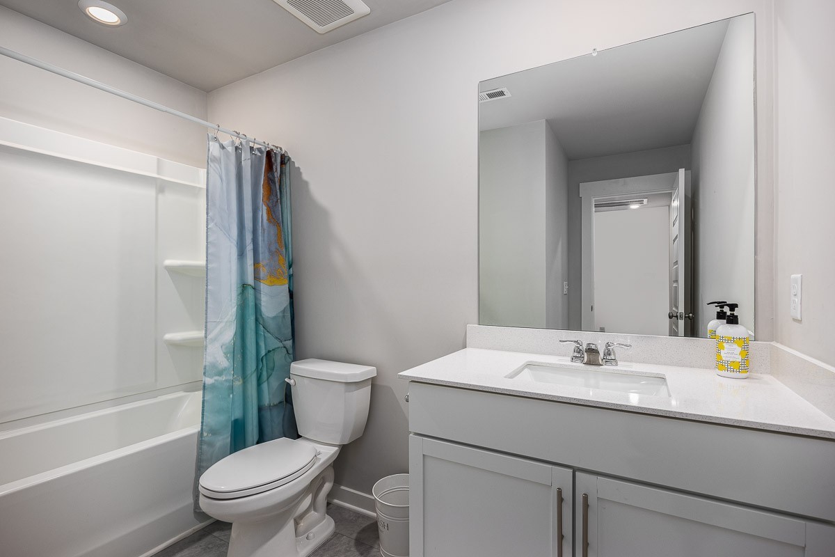 717 Mickelson Way Lebanon, TN 37087 - Photo 19 of 28 a bathroom with a sink toilet and shower