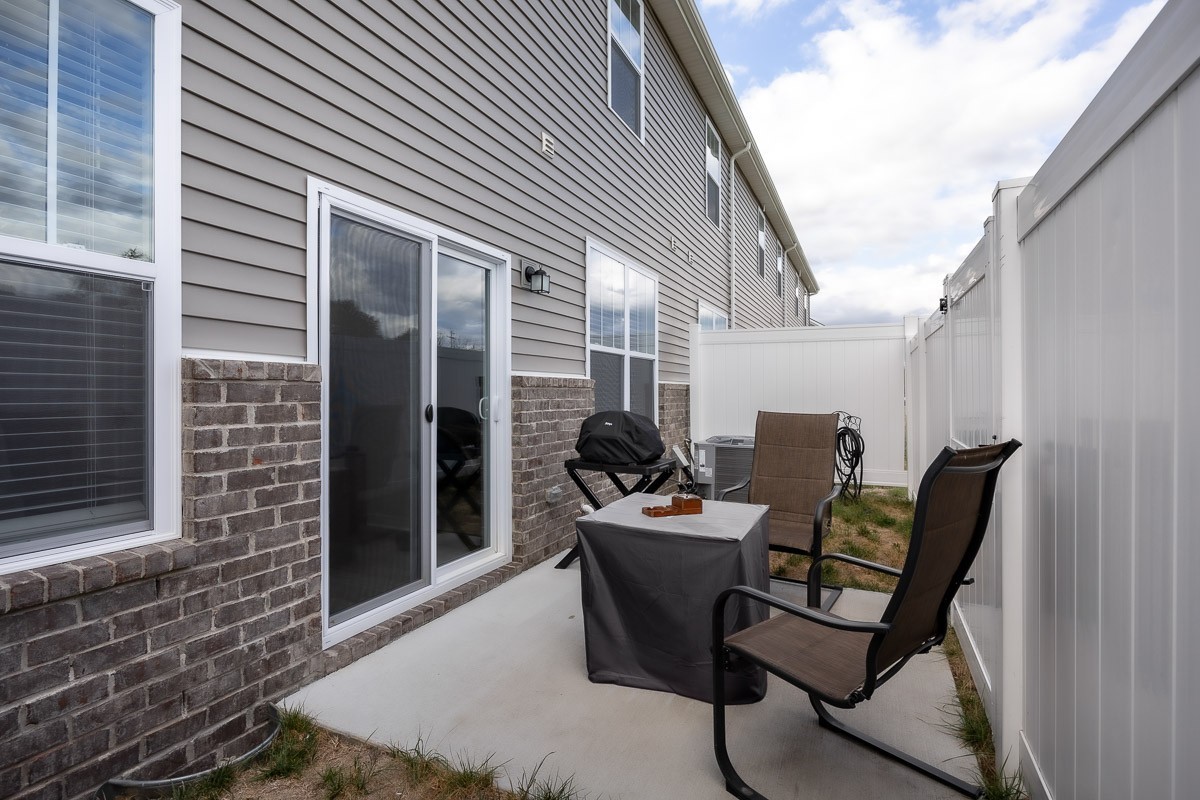 717 Mickelson Way Lebanon, TN 37087 - Photo 22 of 28 a patio with table and chairs and potted plants