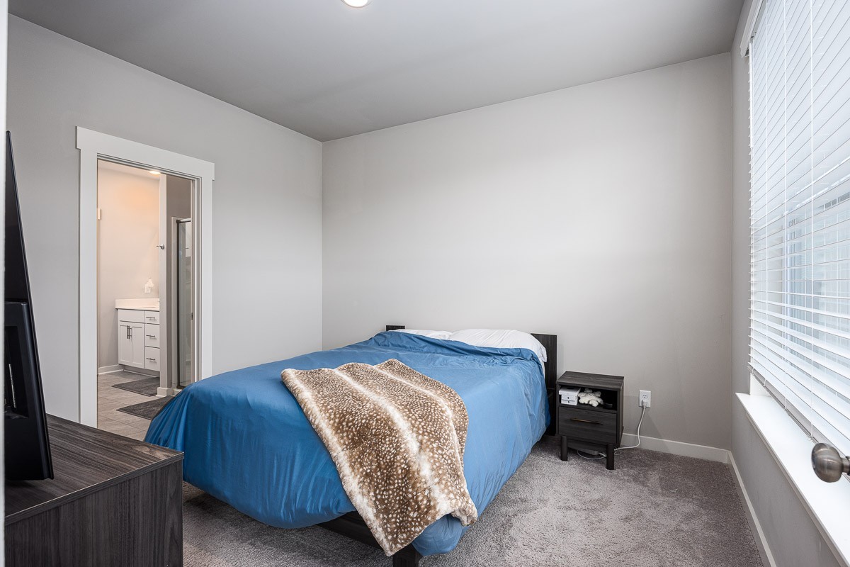 717 Mickelson Way Lebanon, TN 37087 - Photo 10 of 28 a bed sitting in a bedroom next to a window
